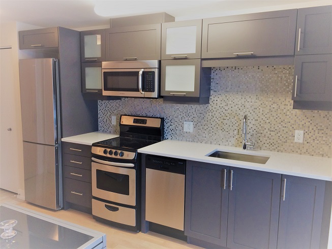 modern kitchen with fridge, stove, dishwasher, microwave